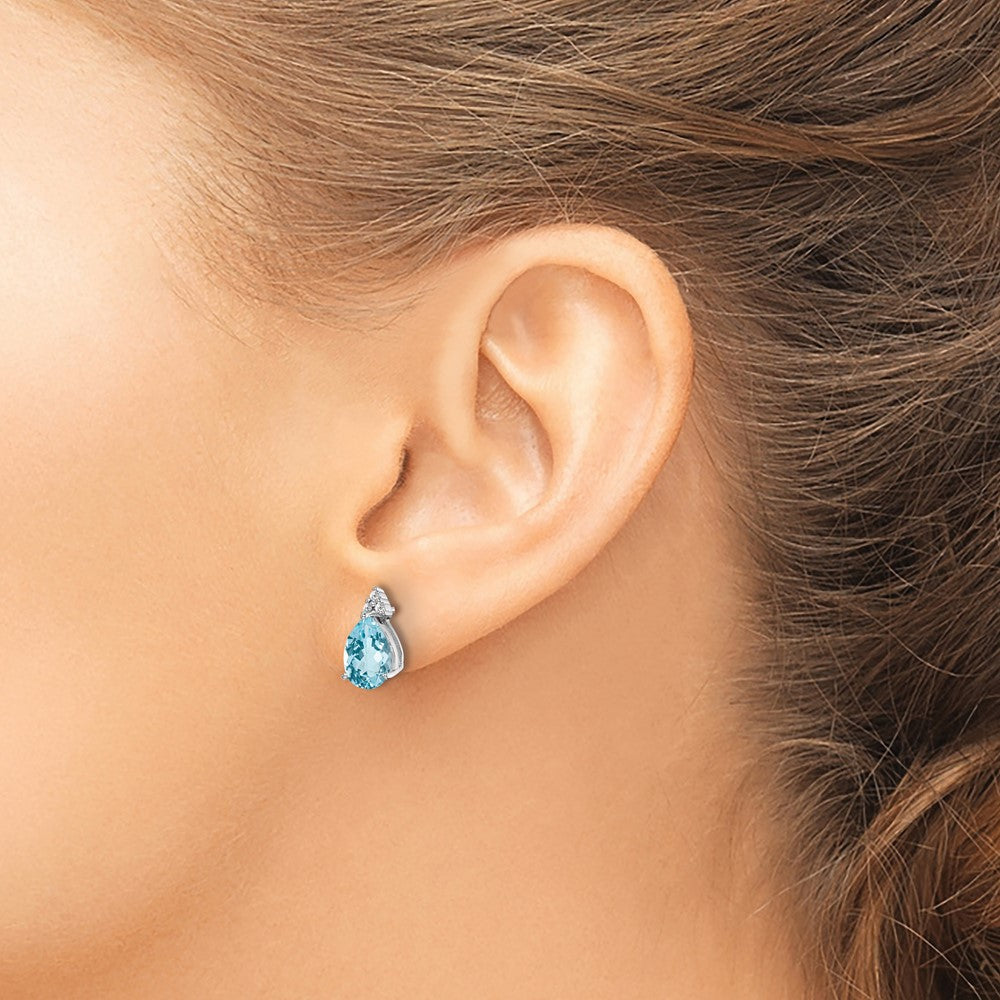 Sterling Silver Rhodium Plated Diamond and Blue Topaz Post Earrings